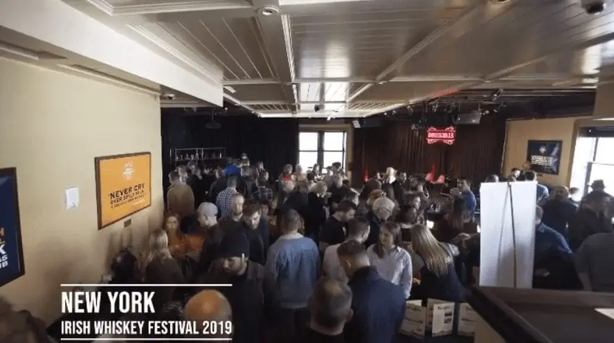 people discussing investing in whiskey casks at the NY Whiskey Fest