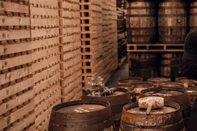 whiskey aficionado Jay Bradley with casks of expensive whiskey